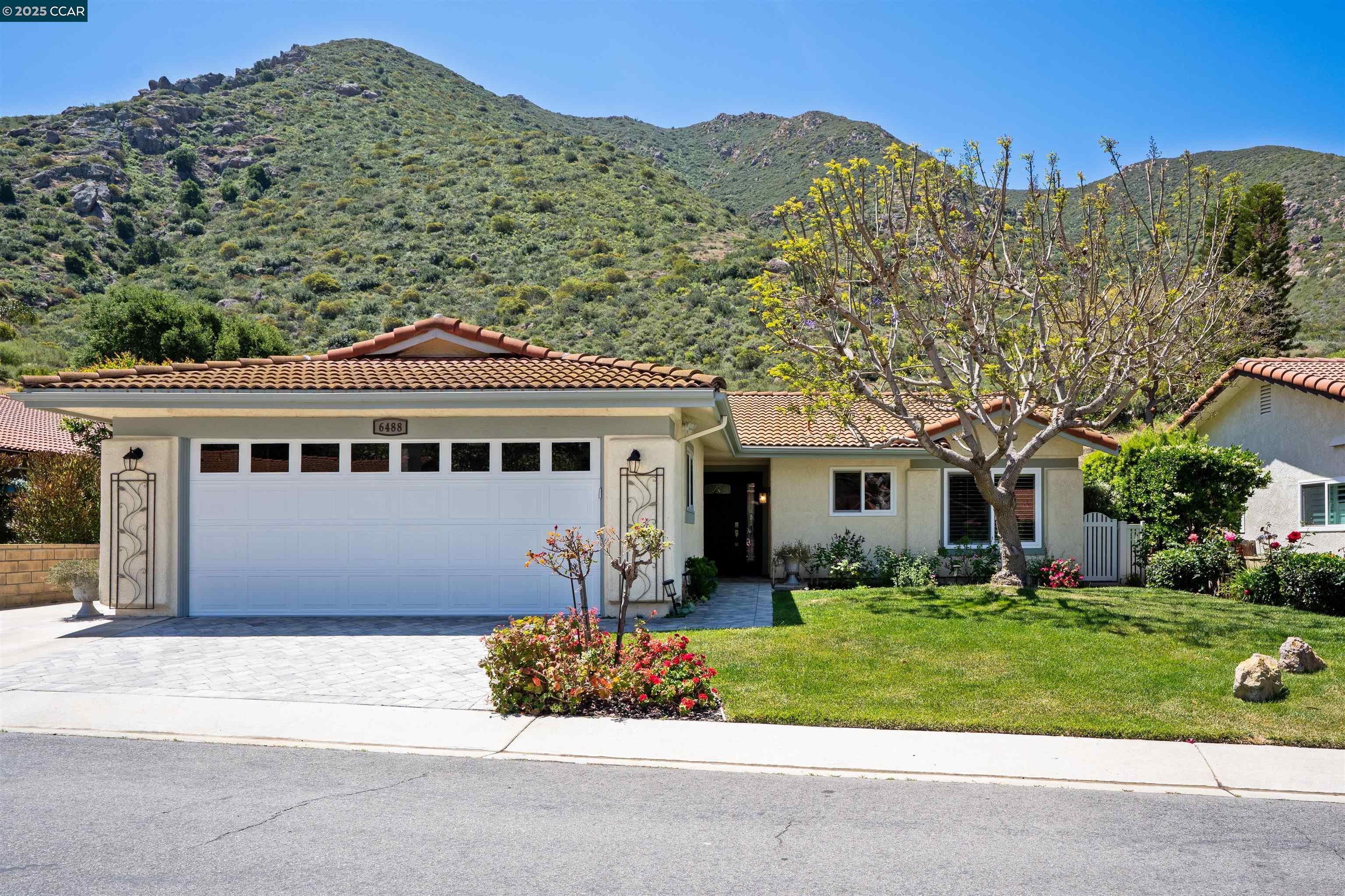 6488 San Como Lane Camarillo, CA 93012 - Photo 1 of 1 front view of a house with a garden