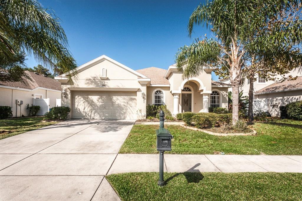 9447 Fairhope Court New Port Richey, FL 34654 - Photo 1 of 1 a front view of a house with a yard