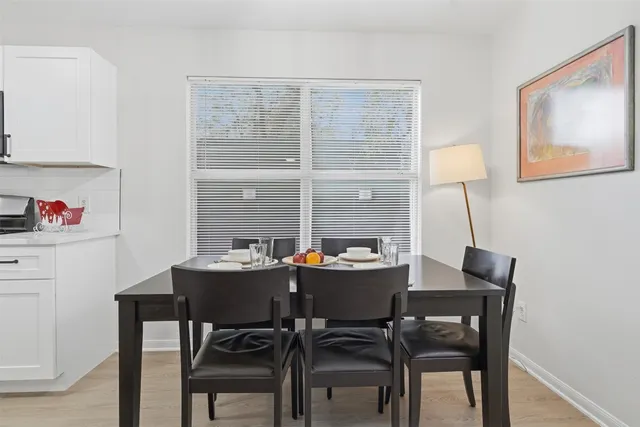 a view of a backyard with large trees