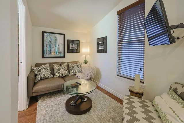 a living room with furniture and a couch