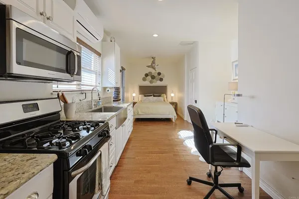 a kitchen with a stove and a microwave