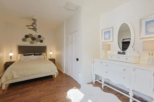 a bedroom with a bed and a dresser