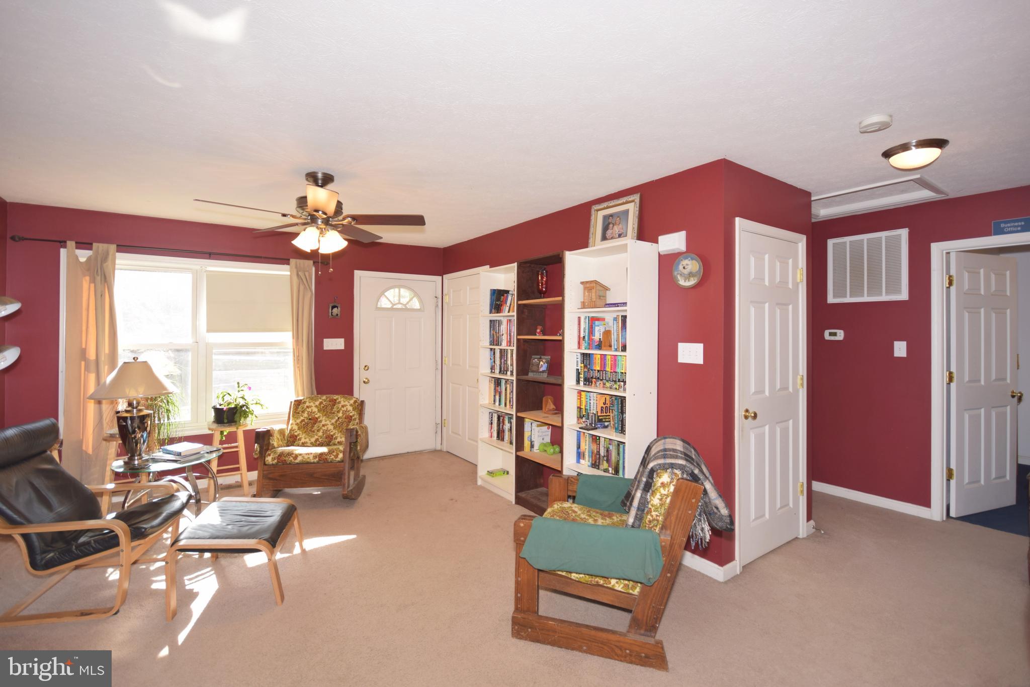 97 Spring Hollow Road Front Royal, VA 22630 - Photo 13 of 38 a living room with furniture and chandelier