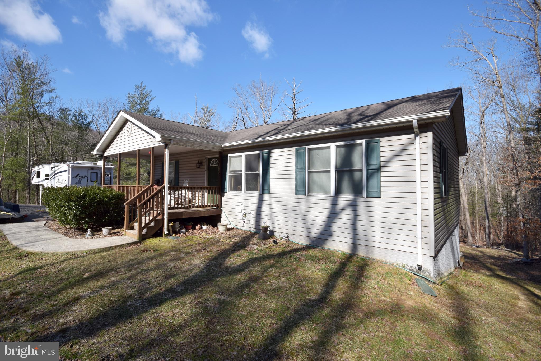 97 Spring Hollow Road Front Royal, VA 22630 - Photo 3 of 38 a front view of a house with a yard
