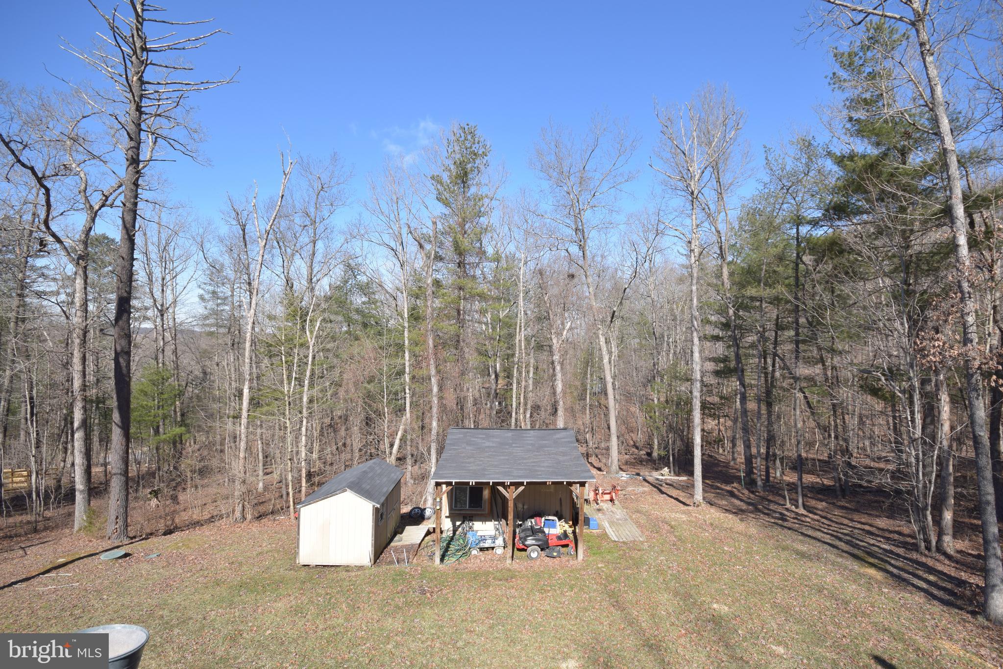 97 Spring Hollow Road Front Royal, VA 22630 - Photo 29 of 38 a backyard of a house with table and chairs