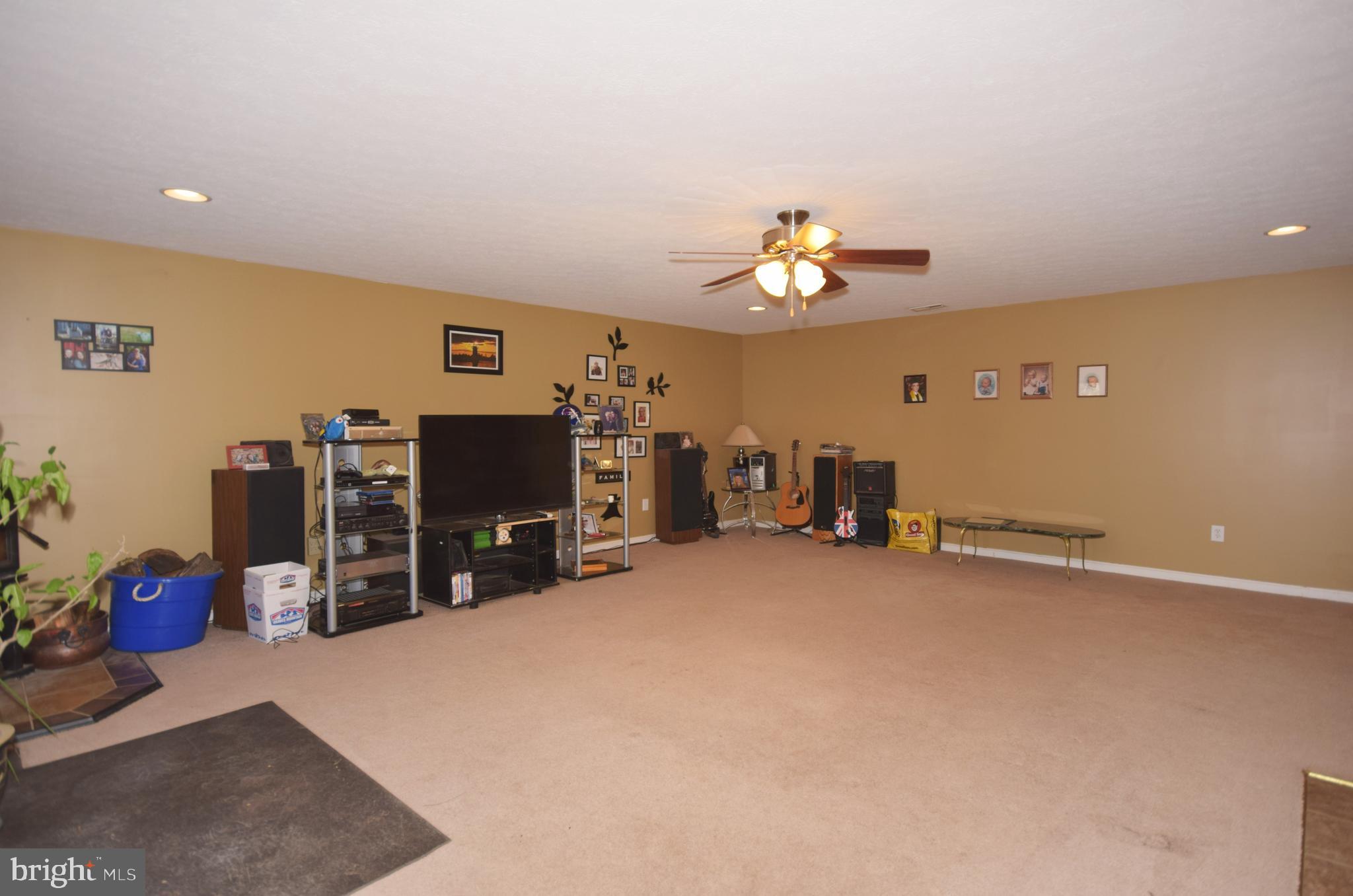 97 Spring Hollow Road Front Royal, VA 22630 - Photo 34 of 38 wooden floor with furniture and a ceiling fan