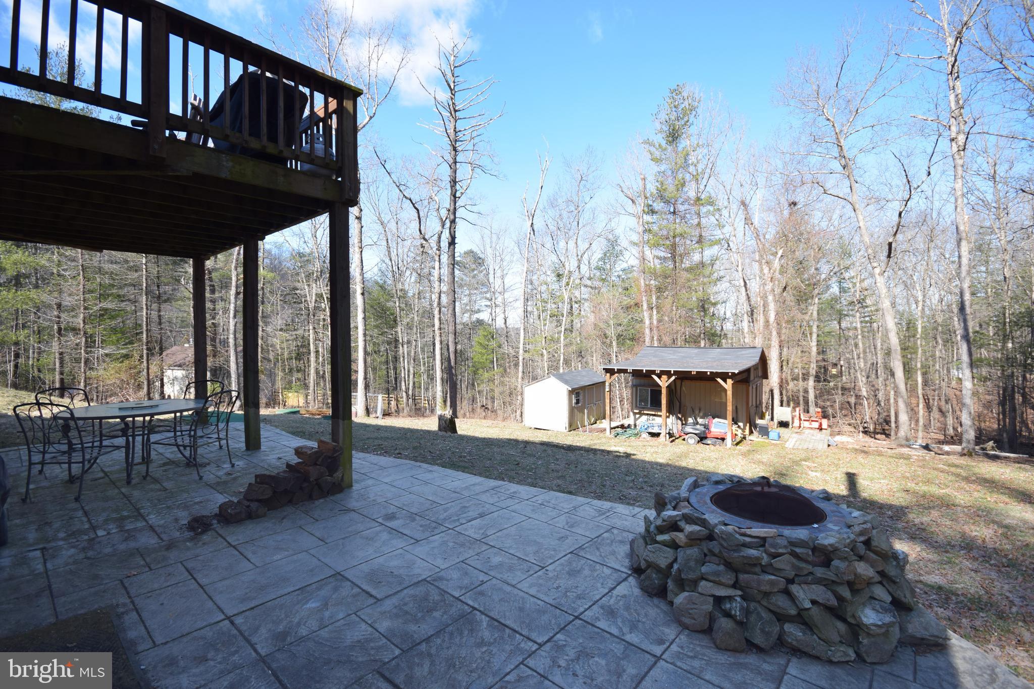 97 Spring Hollow Road Front Royal, VA 22630 - Photo 7 of 38 a view of a chairs and table in the patio