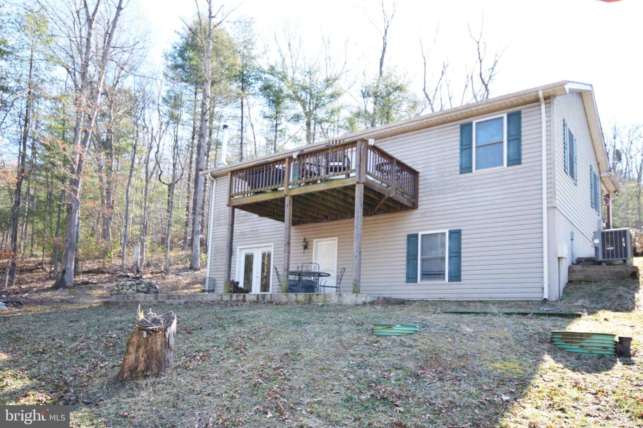 97 Spring Hollow Road Front Royal, VA 22630 - Photo 10 of 38 a view of a house with a yard