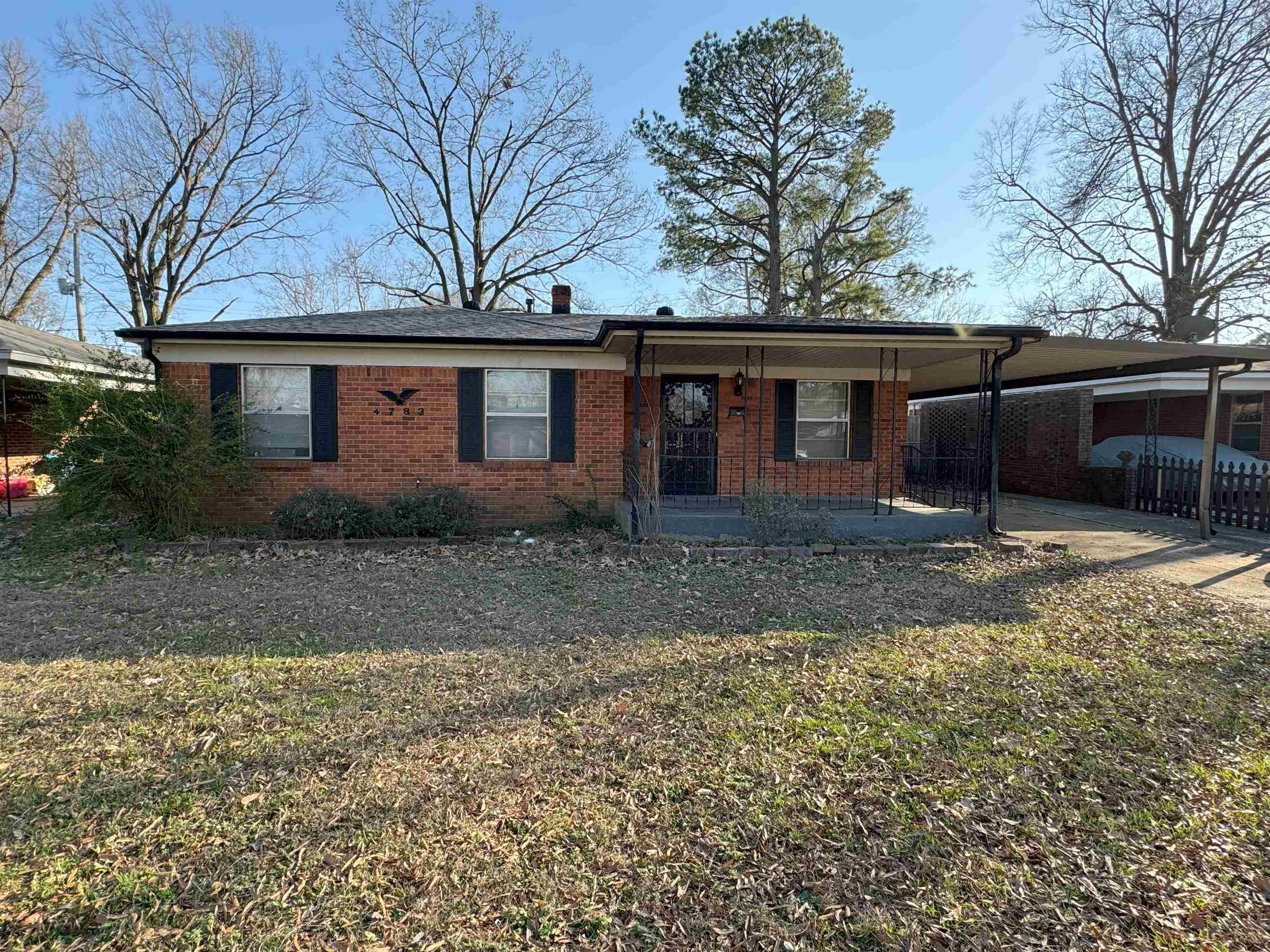 4783 Owen Road Memphis, TN 38122 - Photo 1 of 16 a view of a house with a yard and large tree