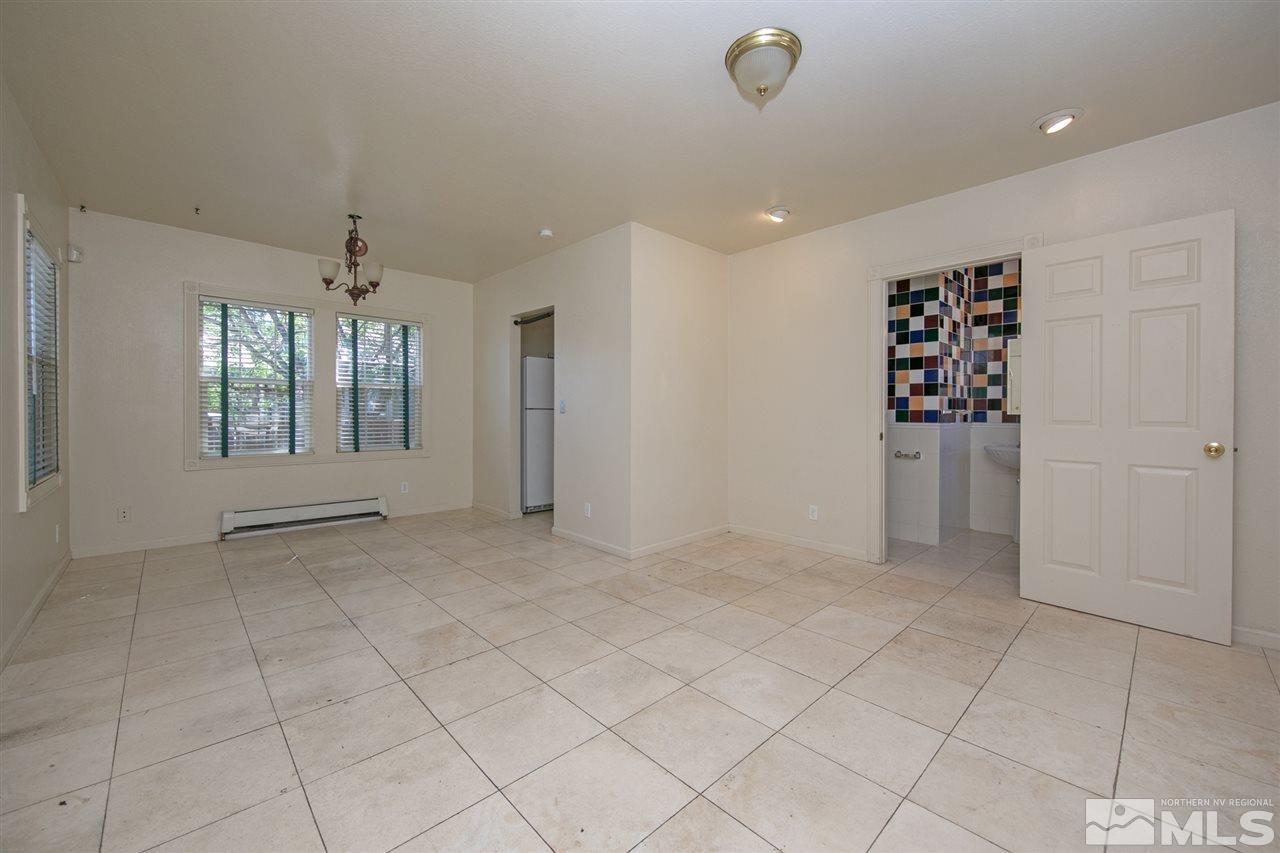 1130 West 1st Street Reno, NV 89503 - Photo 7 of 32 an empty room with windows and closet