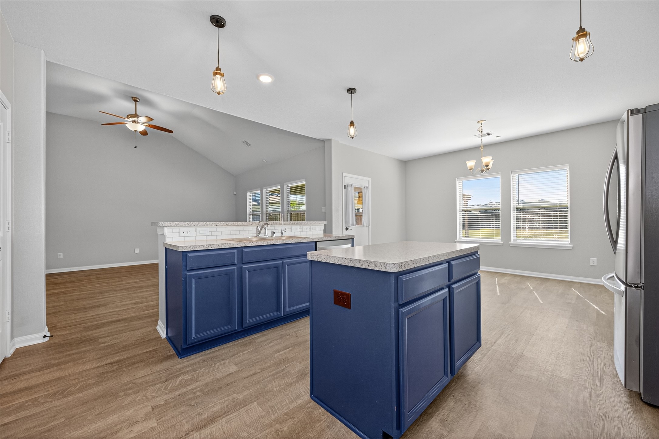 26108 Morgan Cemetery Road Cleveland, TX 77328 - Photo 13 of 39 a kitchen with stainless steel appliances granite countertop a sink a stove and a wooden floors