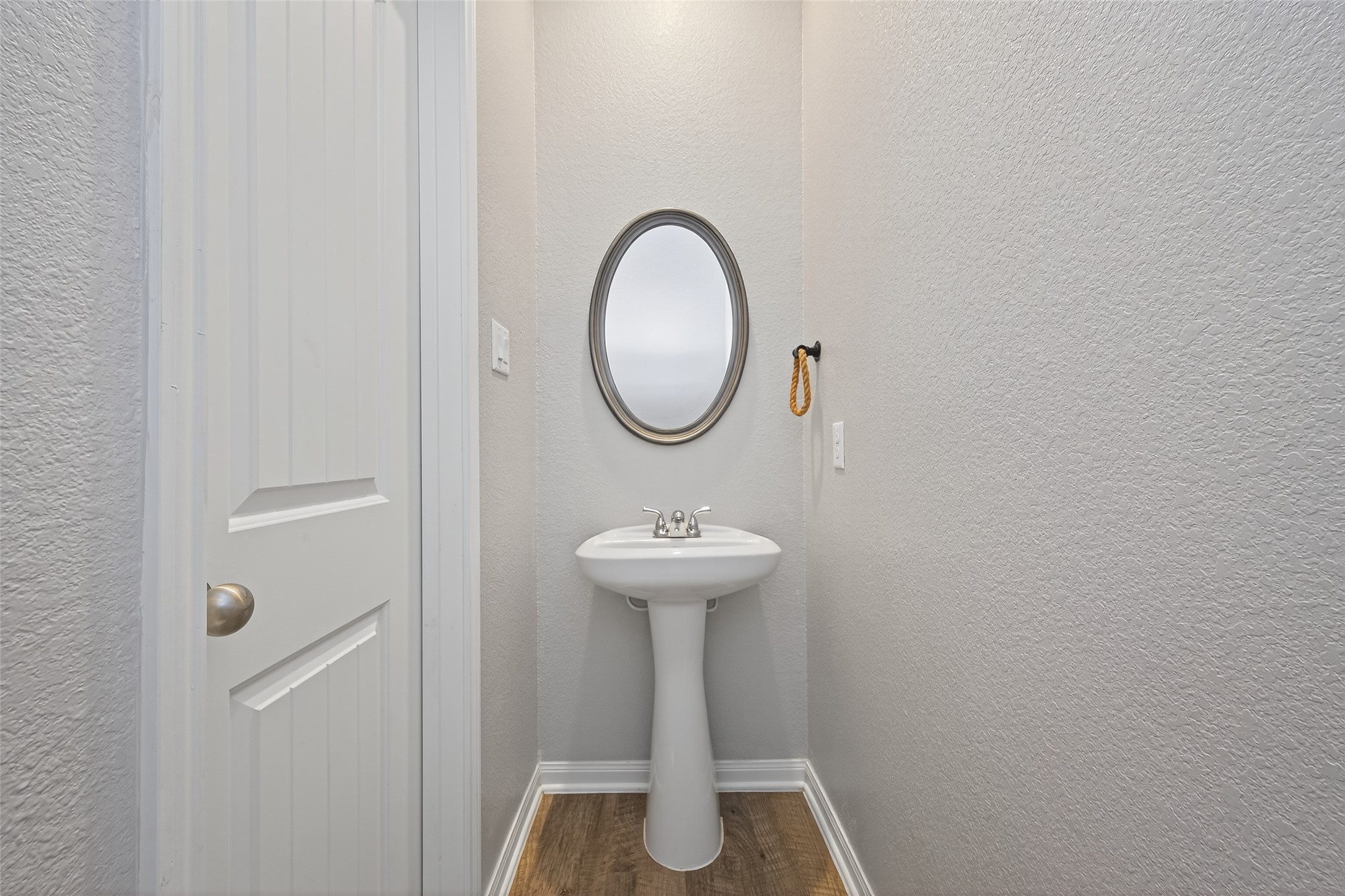 26108 Morgan Cemetery Road Cleveland, TX 77328 - Photo 17 of 39 a bathroom with a sink and a mirror
