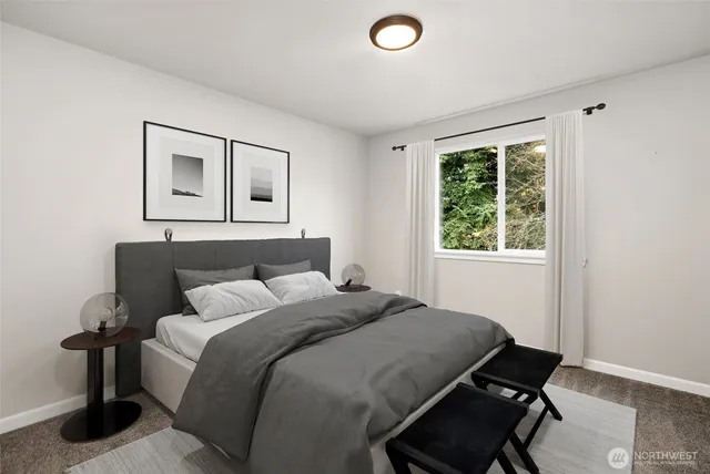 a bedroom with a bed and window