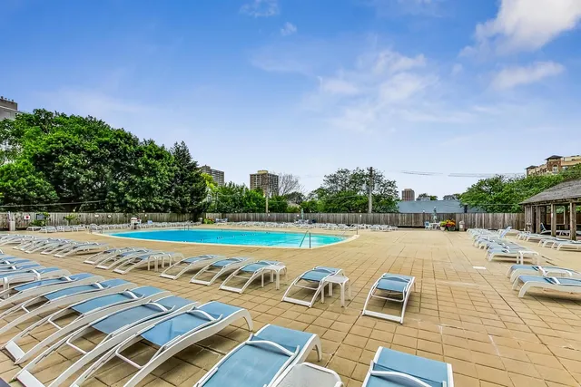 a view of a swimming pool with a lounge chair