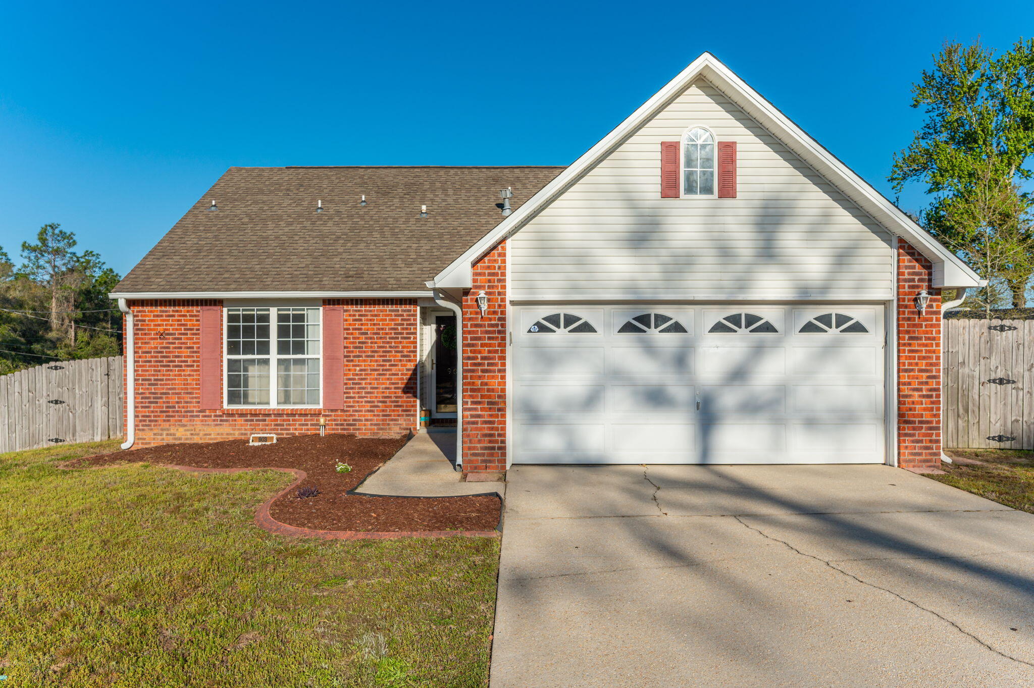 903 Twain Lane Crestview, FL 32536 - Photo 1 of 58 a front view of a house with a yard