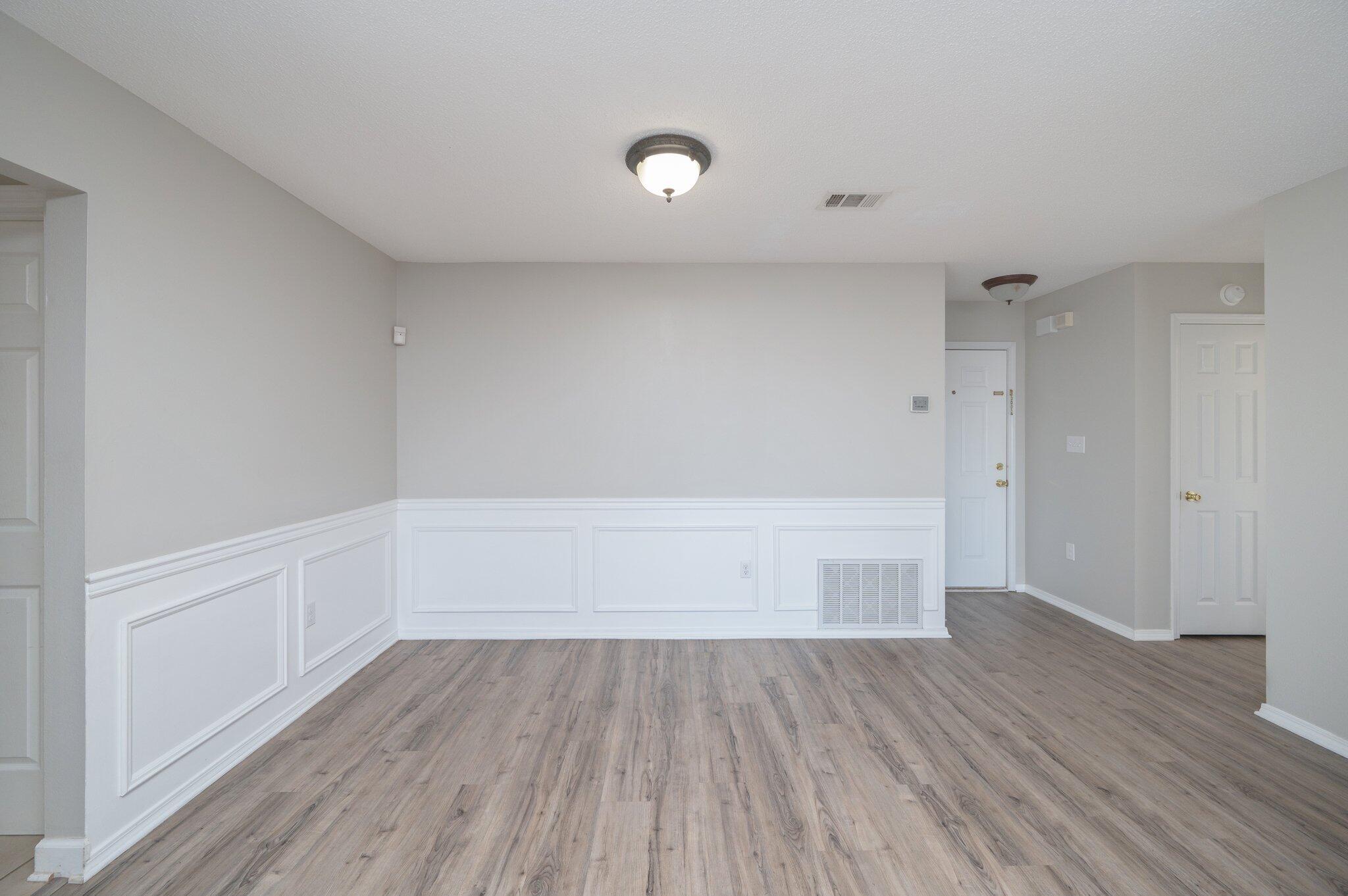 903 Twain Lane Crestview, FL 32536 - Photo 13 of 58 a view of an empty room and wooden floor