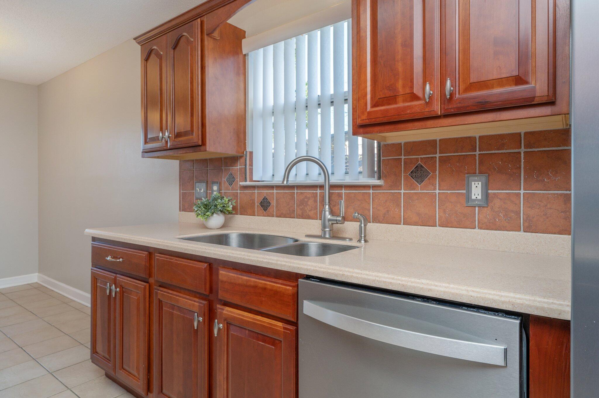 903 Twain Lane Crestview, FL 32536 - Photo 19 of 58 a kitchen with stainless steel appliances granite countertop a sink and cabinets