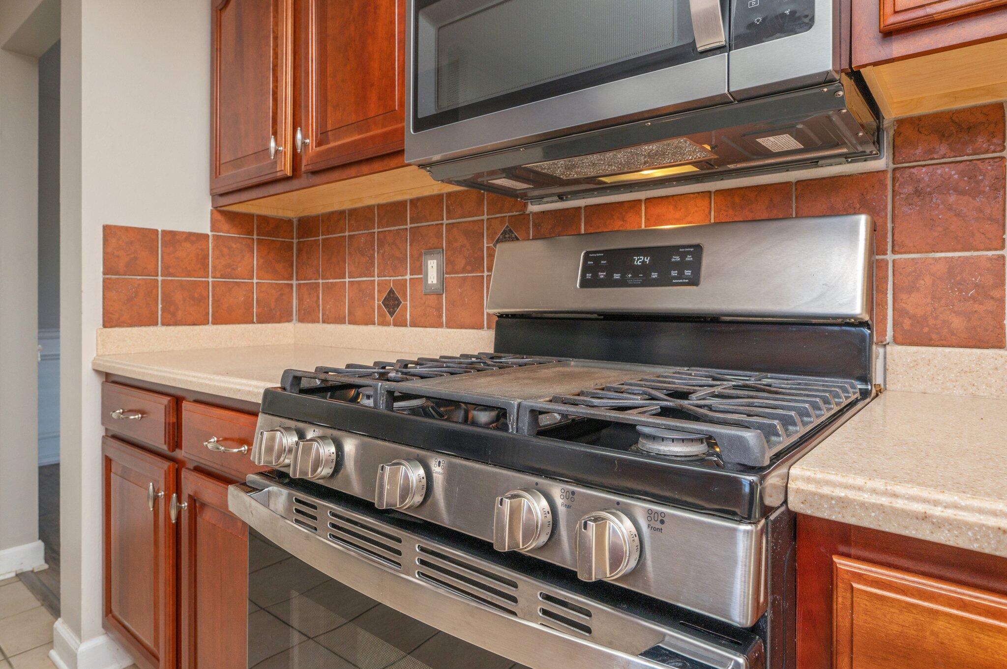 903 Twain Lane Crestview, FL 32536 - Photo 20 of 58 a stove top oven sitting inside of a kitchen