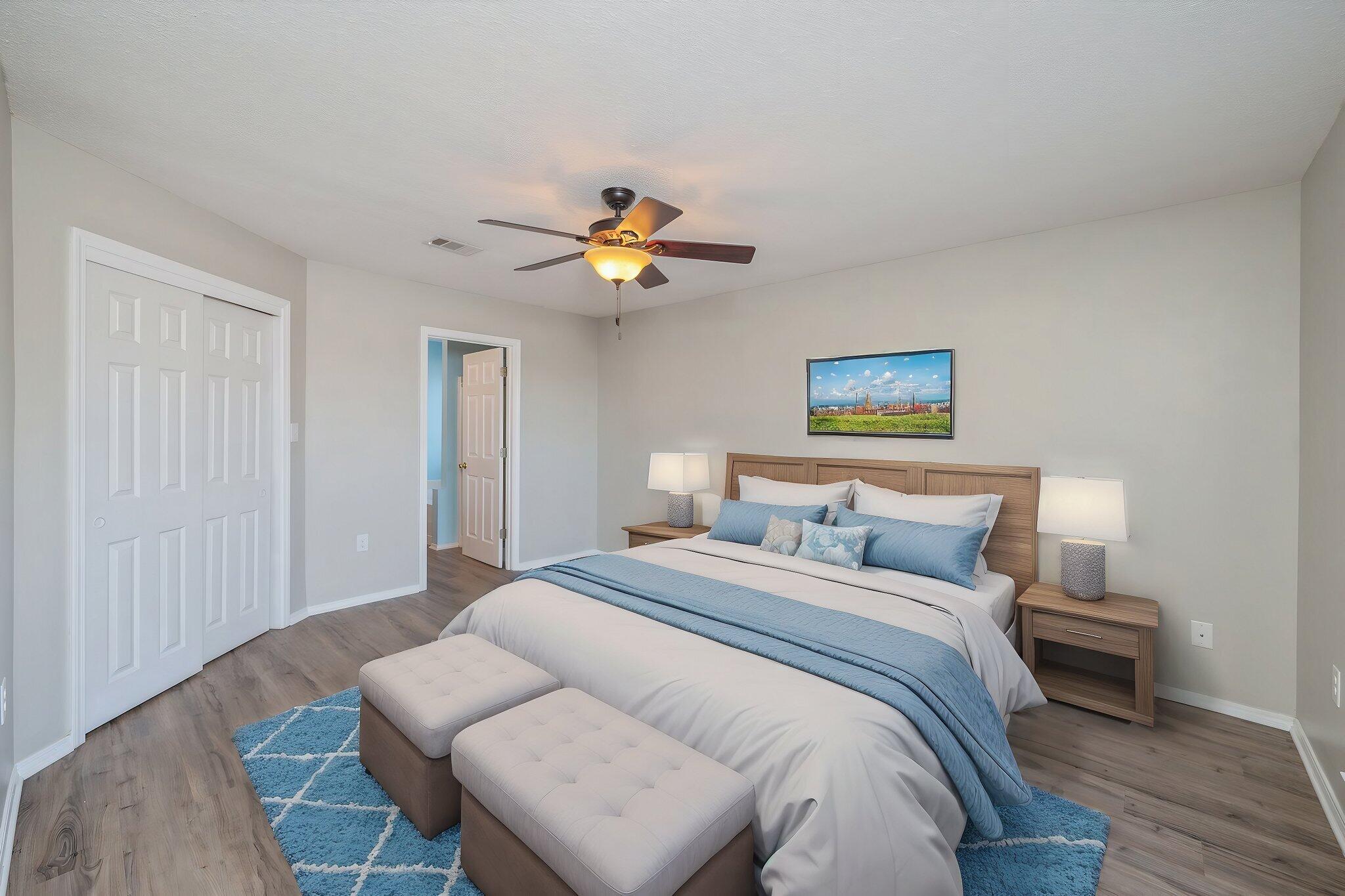903 Twain Lane Crestview, FL 32536 - Photo 24 of 58 a bedroom with a bed and a chandelier