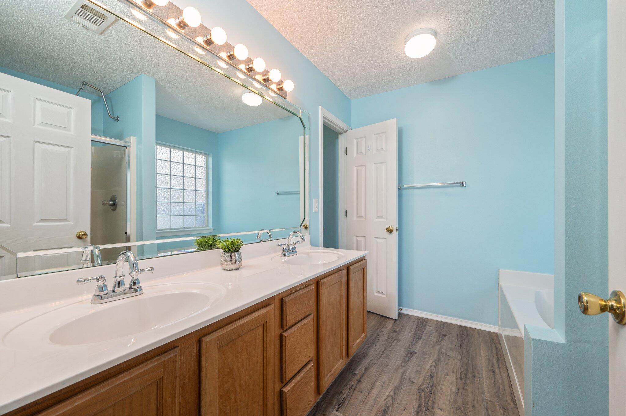 903 Twain Lane Crestview, FL 32536 - Photo 26 of 58 a bathroom with a double vanity sink and a mirror