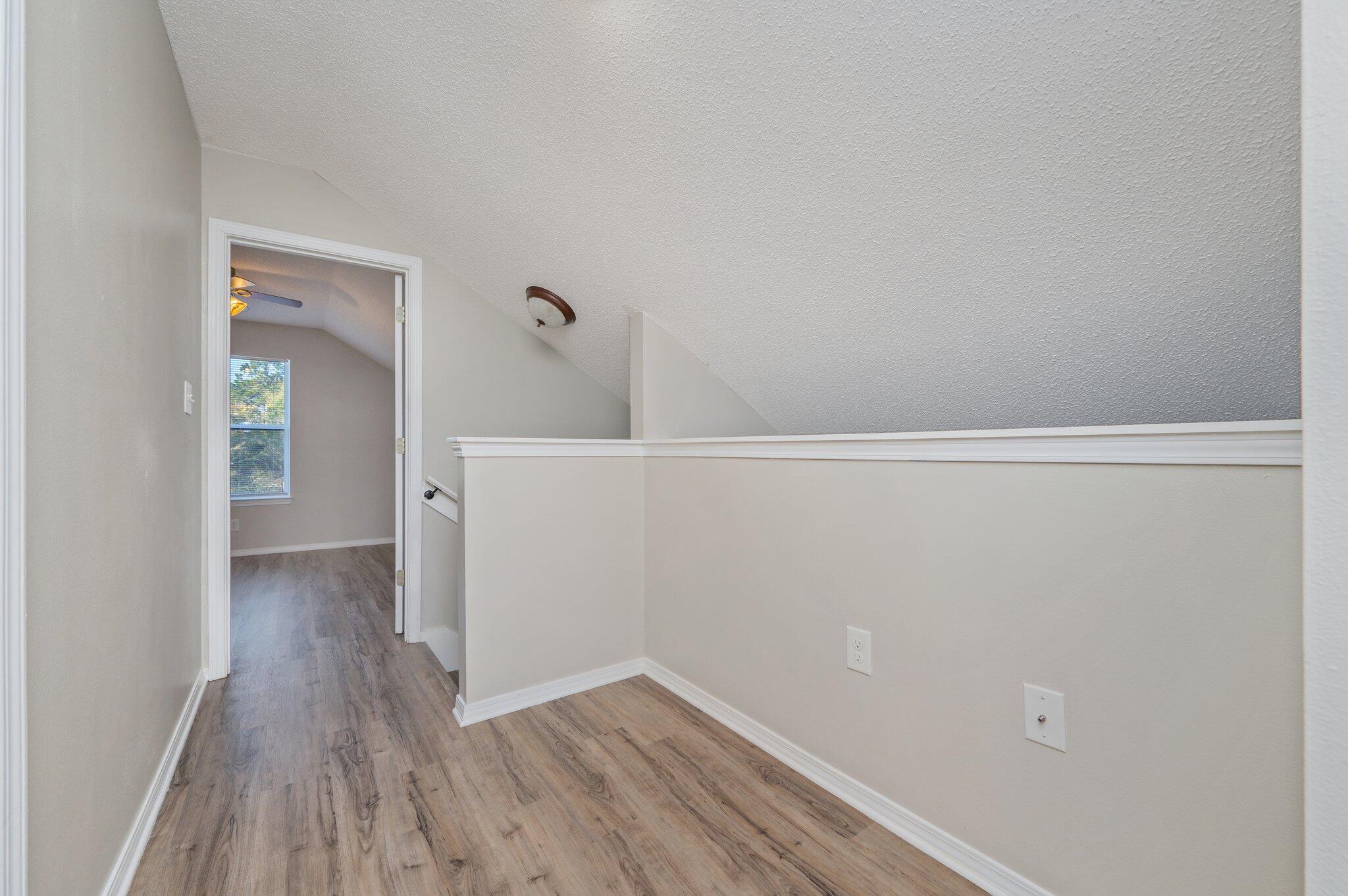 903 Twain Lane Crestview, FL 32536 - Photo 39 of 58 a view of a small space with wooden floor and a bathroom