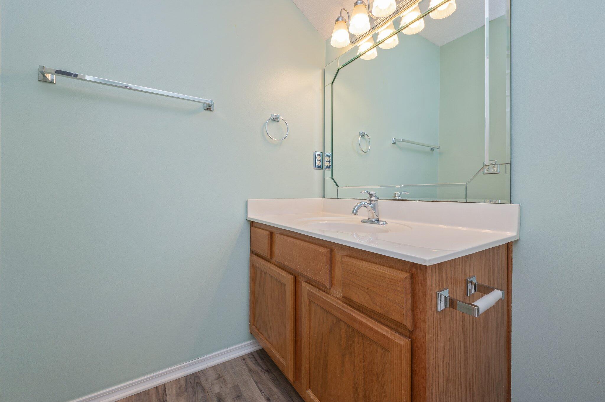 903 Twain Lane Crestview, FL 32536 - Photo 44 of 58 a bathroom with a sink a mirror and vanity