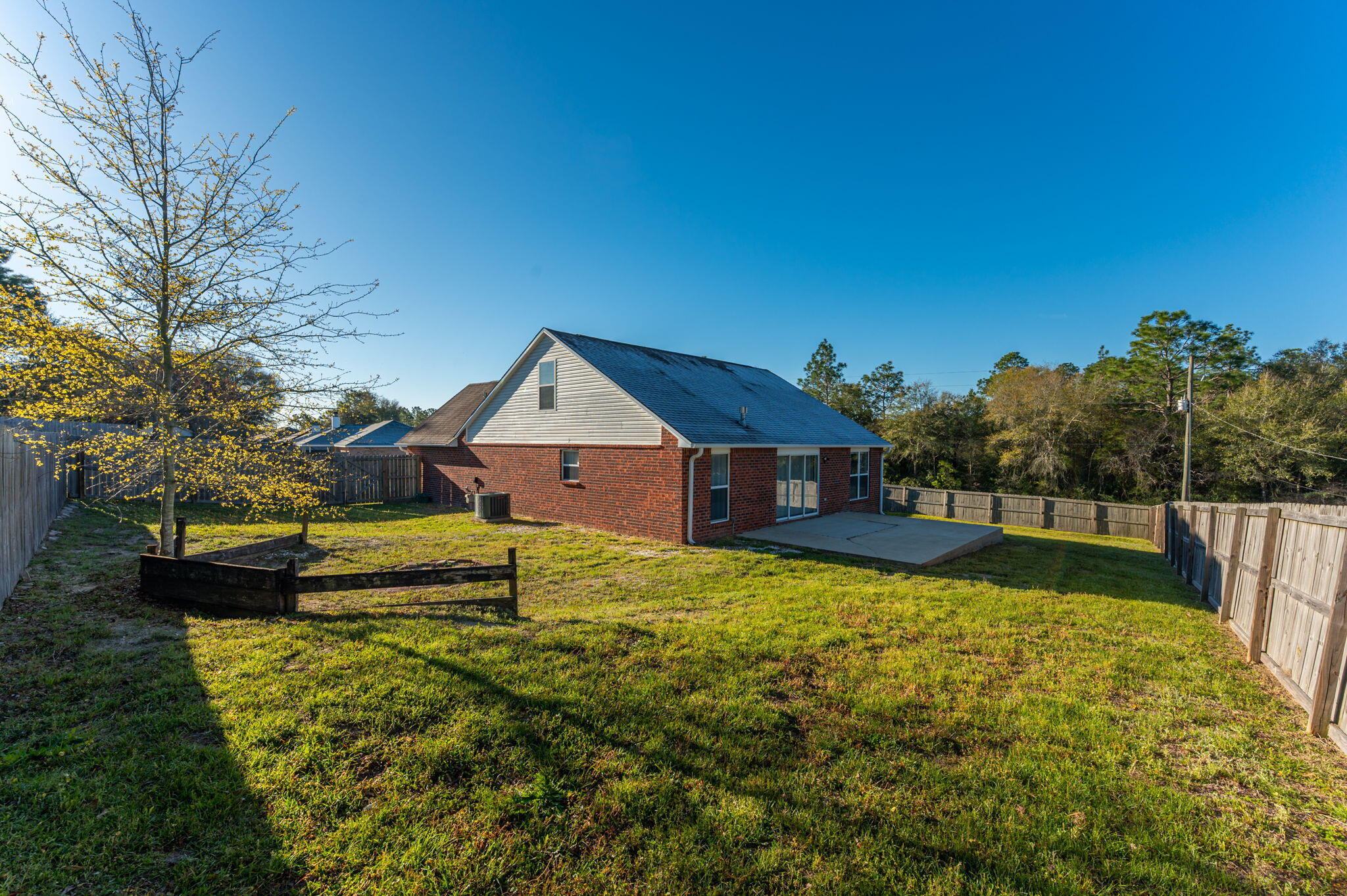 903 Twain Lane Crestview, FL 32536 - Photo 47 of 58 a front view of a house with a yard