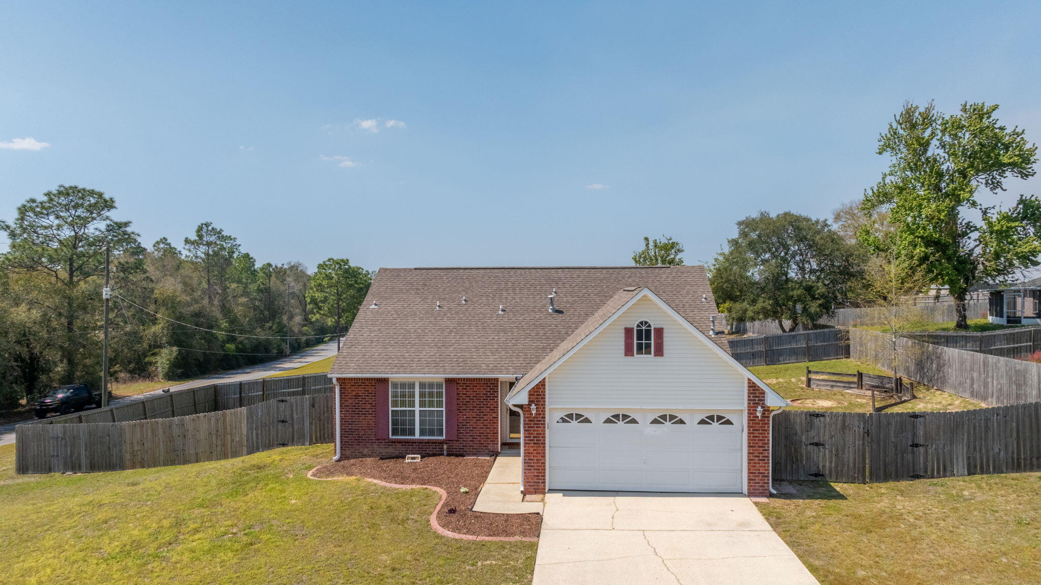 903 Twain Lane Crestview, FL 32536 - Photo 50 of 58 a front view of a house with a yard