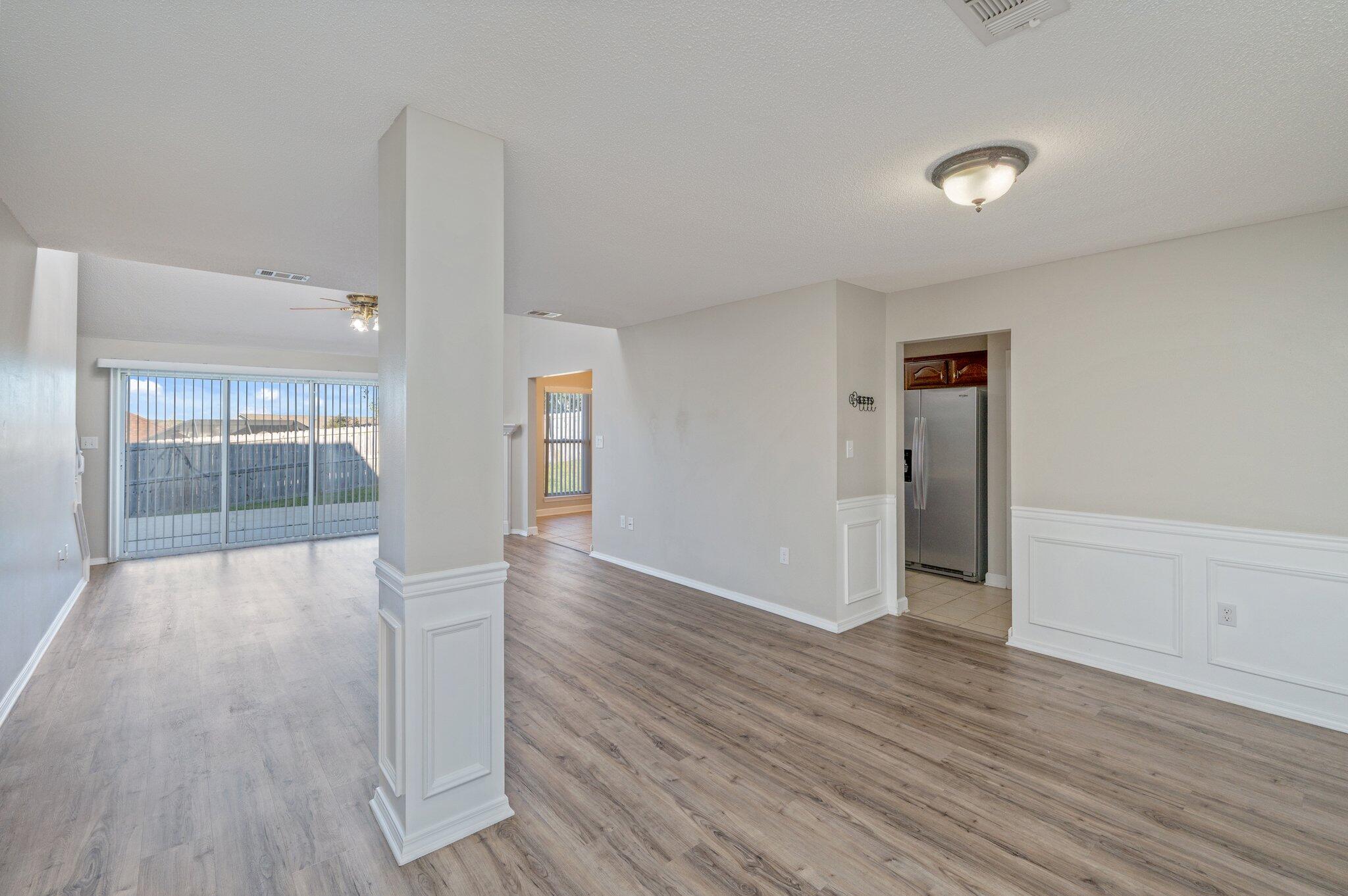 903 Twain Lane Crestview, FL 32536 - Photo 5 of 58 a view of an empty room and wooden floor