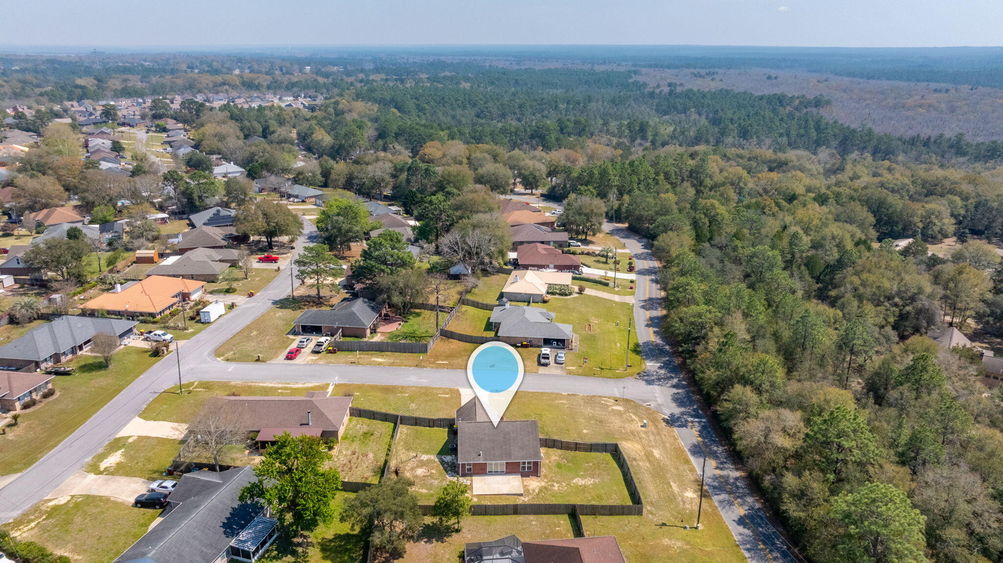 903 Twain Lane Crestview, FL 32536 - Photo 57 of 58 an aerial view of a house with a garden