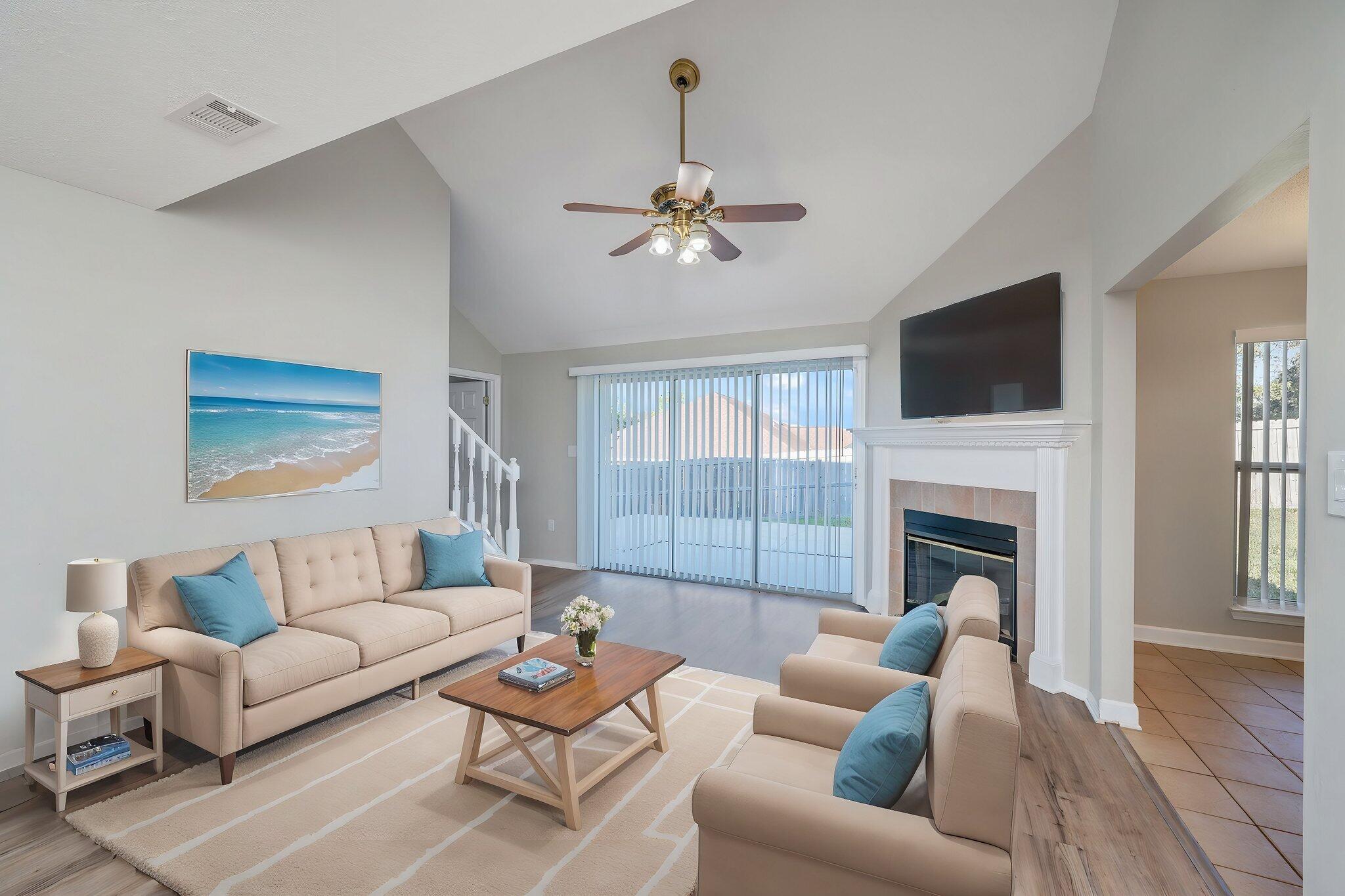 903 Twain Lane Crestview, FL 32536 - Photo 7 of 58 a living room with furniture a fireplace and a flat screen tv
