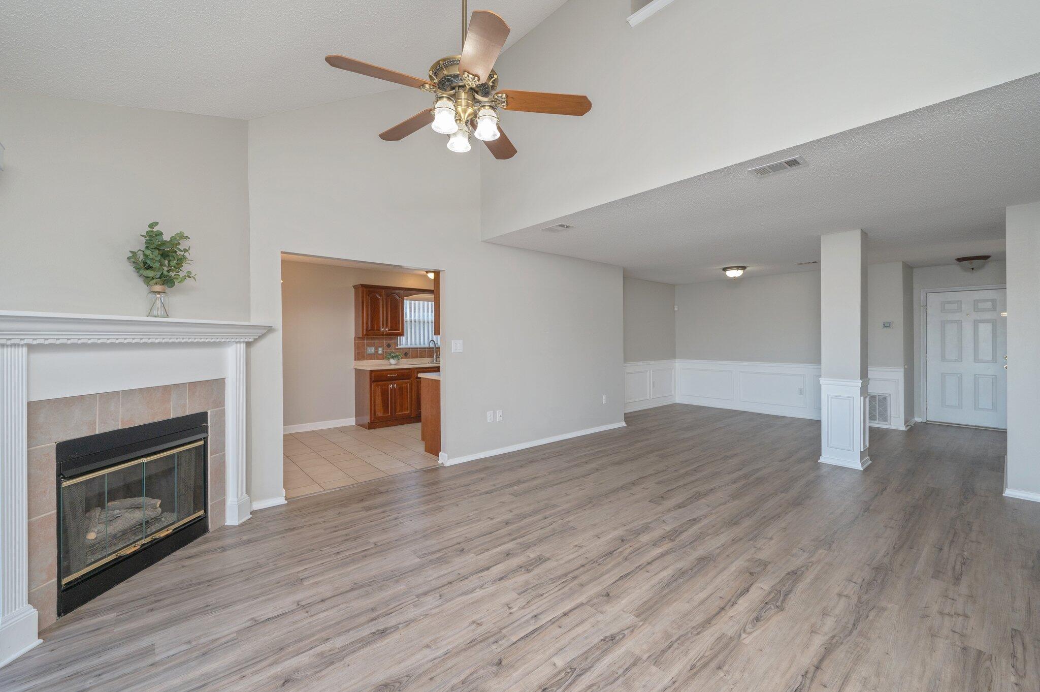 903 Twain Lane Crestview, FL 32536 - Photo 10 of 58 a view of empty room with wooden floor and fireplace