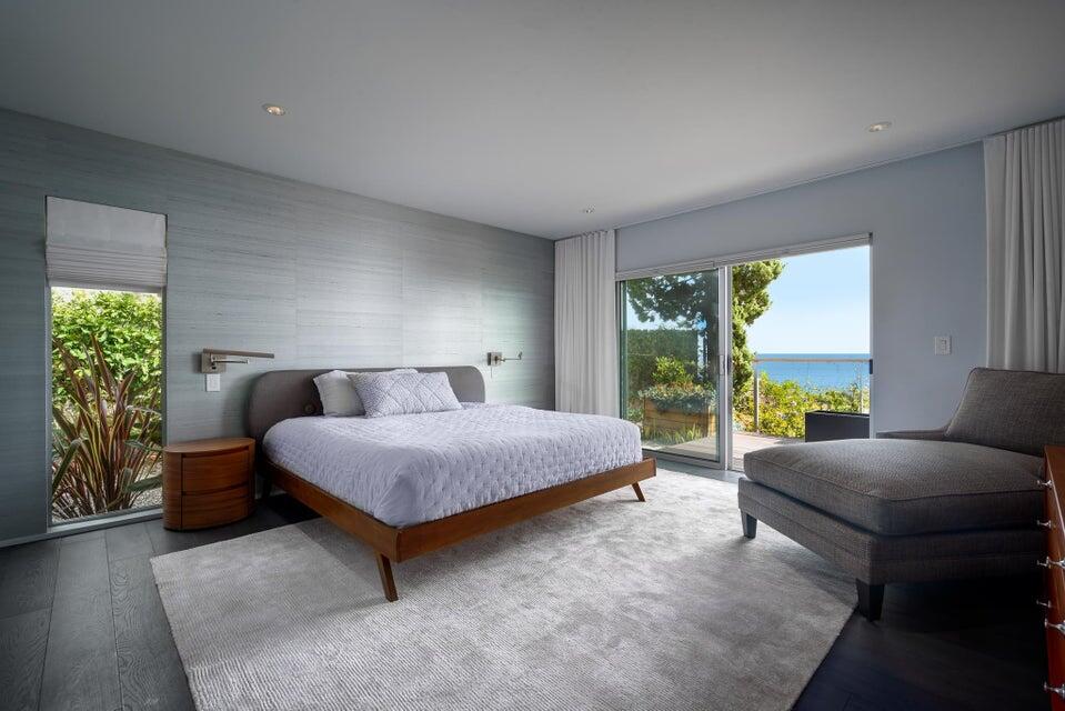 80 Chase Drive Santa Barbara, CA 93108 - Photo 12 of 18 a spacious bedroom with a bed and glass window
