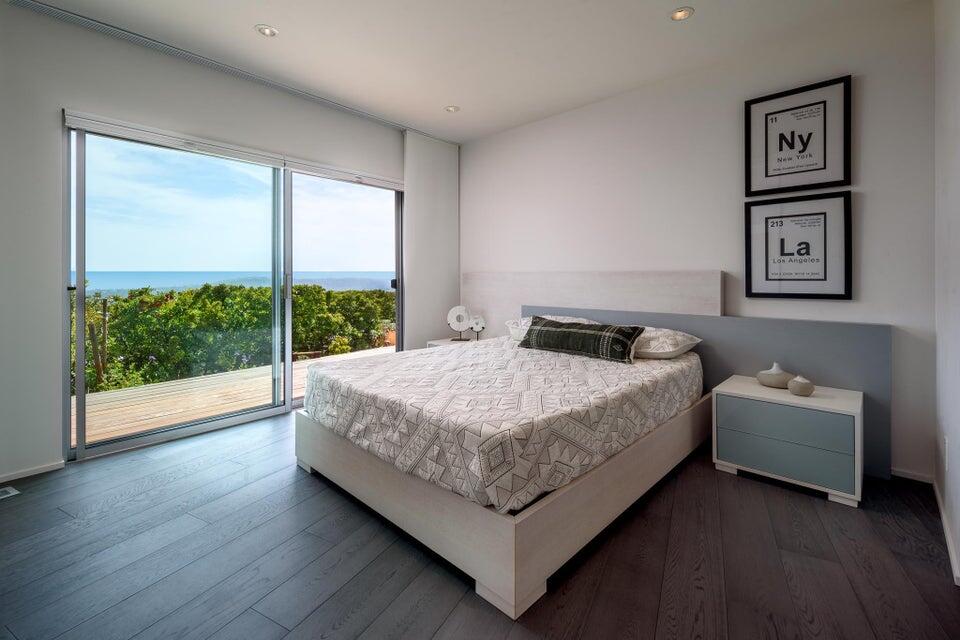 80 Chase Drive Santa Barbara, CA 93108 - Photo 14 of 18 a bedroom with a bed and a large window