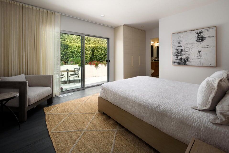 80 Chase Drive Santa Barbara, CA 93108 - Photo 15 of 18 a bedroom with a large bed couch and a large window