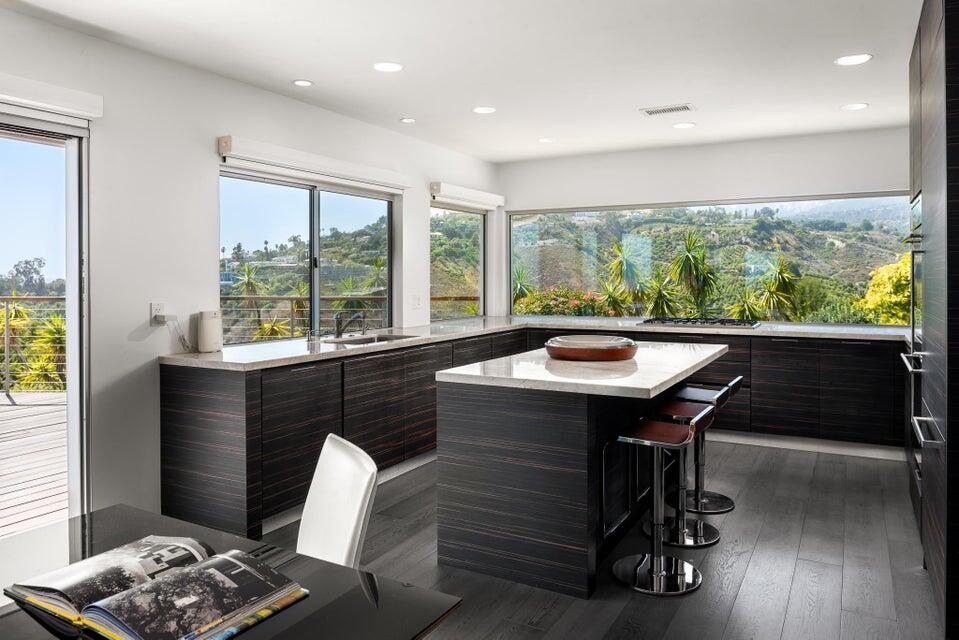 80 Chase Drive Santa Barbara, CA 93108 - Photo 8 of 18 a view of a dining room with a table and chairs