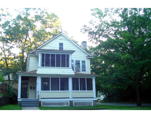 82-84 Lakeside Street Springfield, MA 01109 - Photo 2 of 2 a front view of a house with a tree