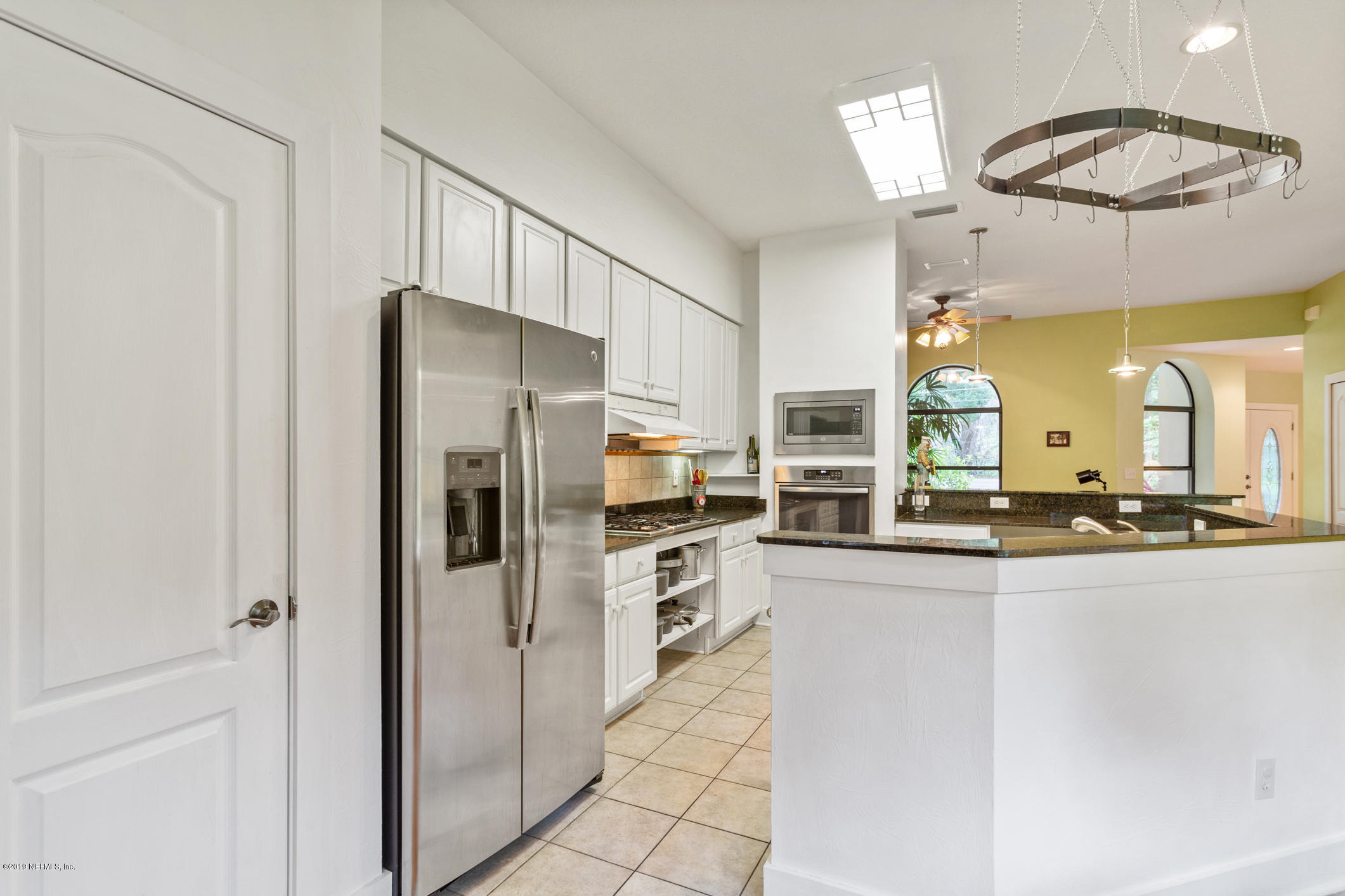 12940 Brady Road Jacksonville, FL 32223 - Photo 12 of 31 a kitchen with stainless steel appliances granite countertop a refrigerator and a stove top oven