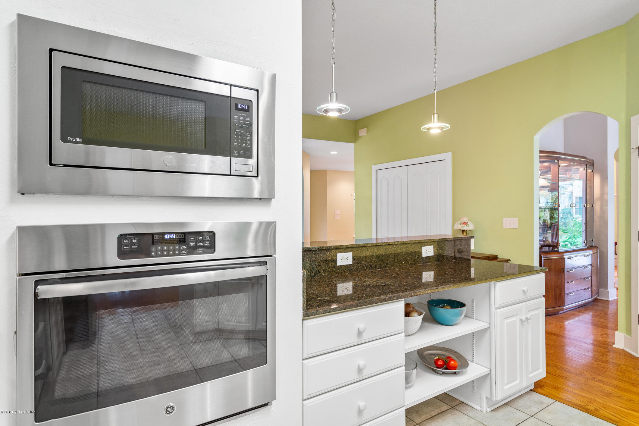 12940 Brady Road Jacksonville, FL 32223 - Photo 13 of 31 a kitchen with a stove and a microwave
