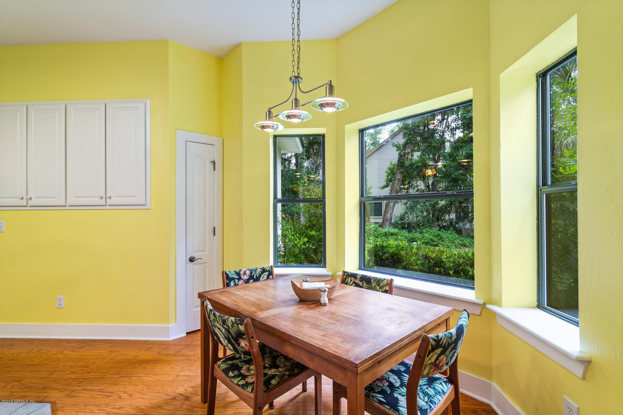 12940 Brady Road Jacksonville, FL 32223 - Photo 14 of 31 a view of a dining room with furniture window and wooden floor