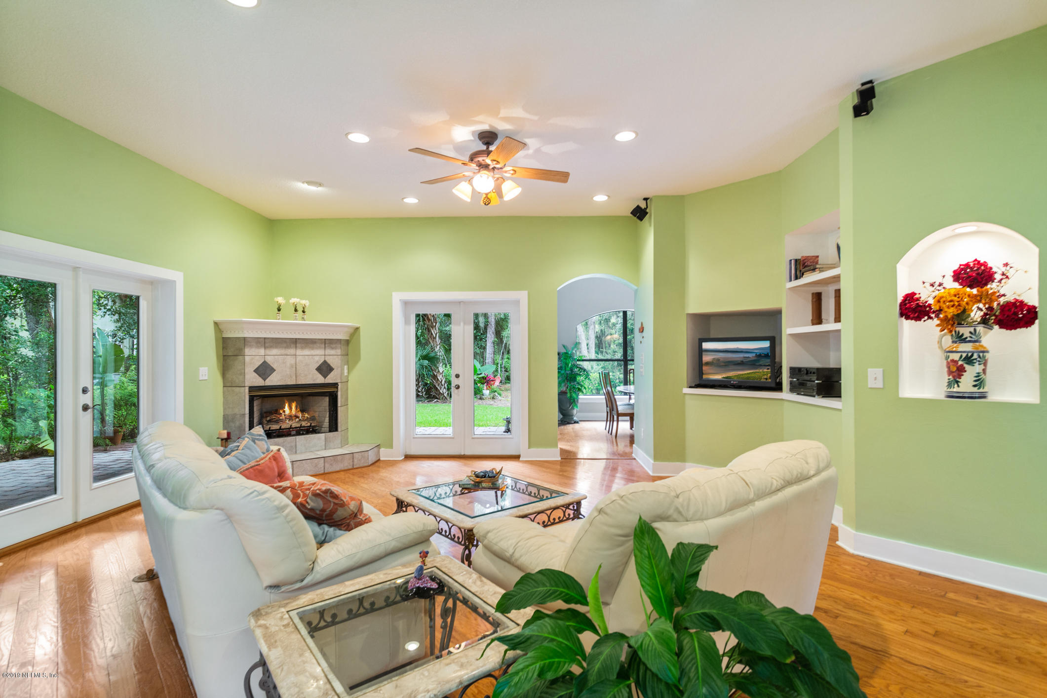 12940 Brady Road Jacksonville, FL 32223 - Photo 16 of 31 a living room with fireplace furniture and a large window