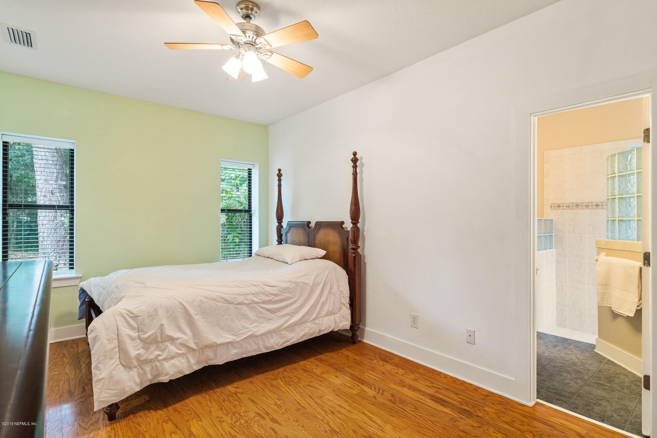 12940 Brady Road Jacksonville, FL 32223 - Photo 20 of 31 a bedroom with a bed and a window