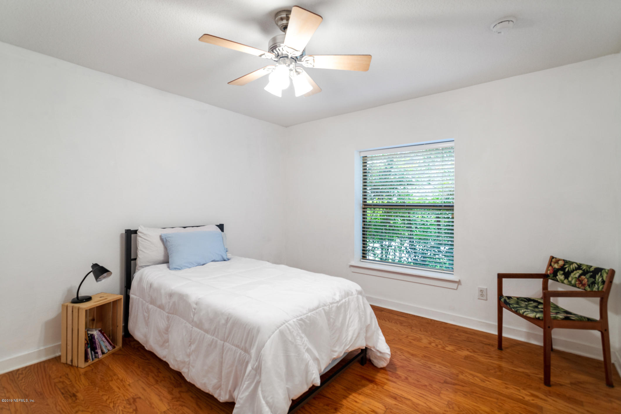 12940 Brady Road Jacksonville, FL 32223 - Photo 26 of 31 a bedroom with a bed and a window
