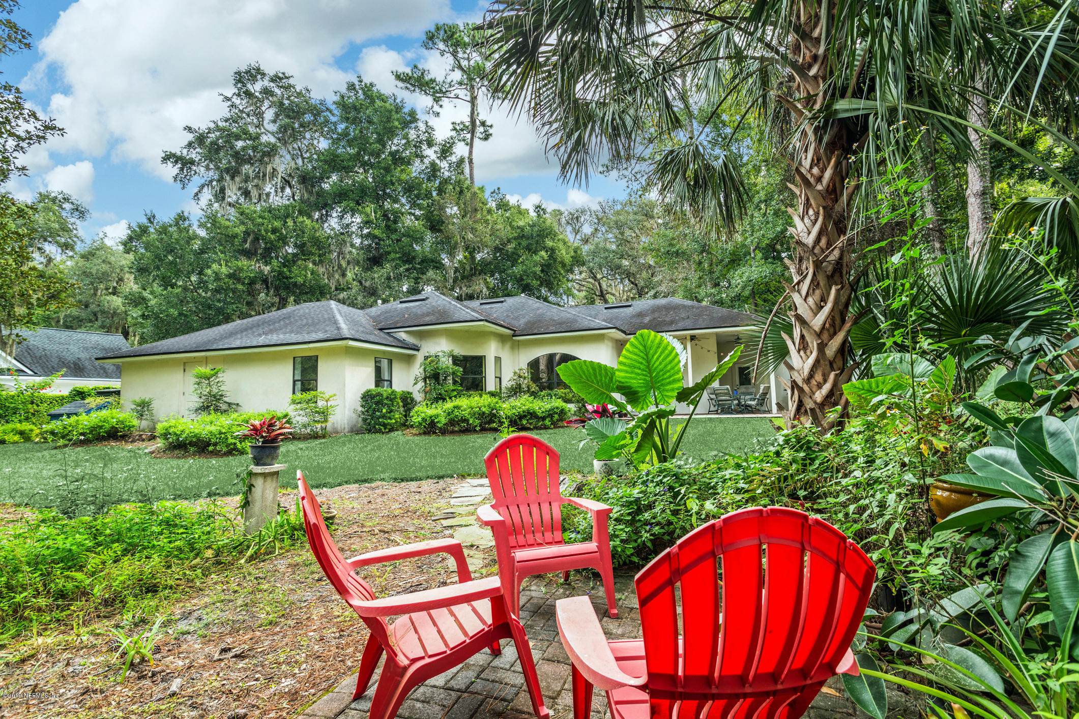 12940 Brady Road Jacksonville, FL 32223 - Photo 28 of 31 a view of a chairs in backyard of a house