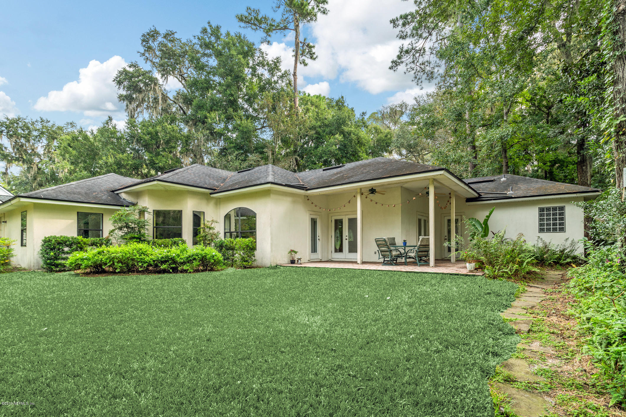12940 Brady Road Jacksonville, FL 32223 - Photo 29 of 31 a front view of a house with a yard and trees