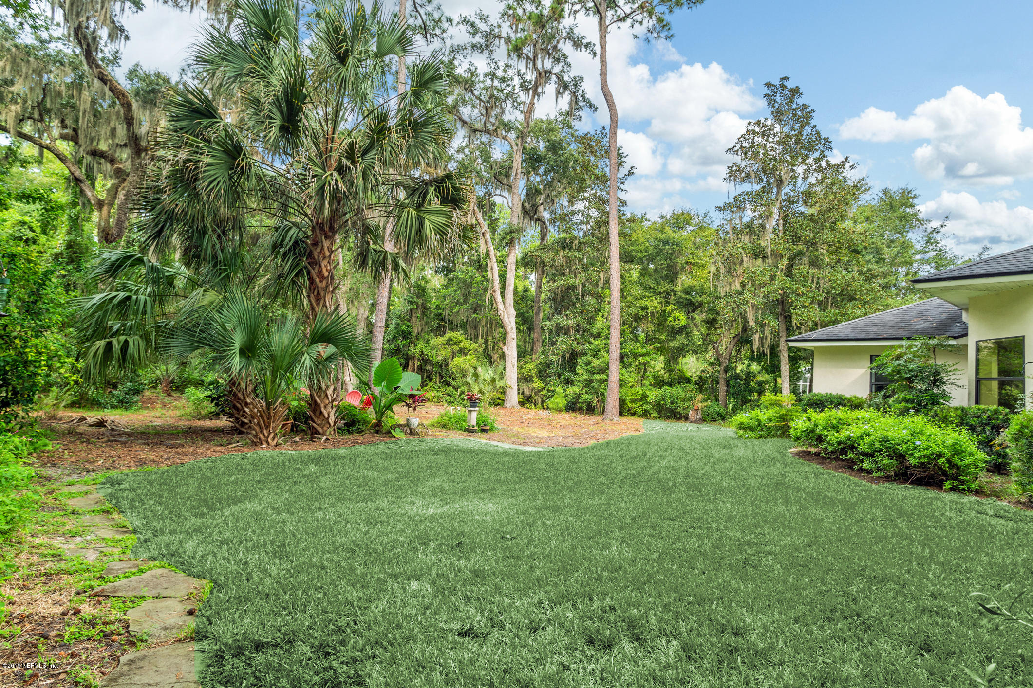 12940 Brady Road Jacksonville, FL 32223 - Photo 30 of 31 a view of a house with a yard and sitting area