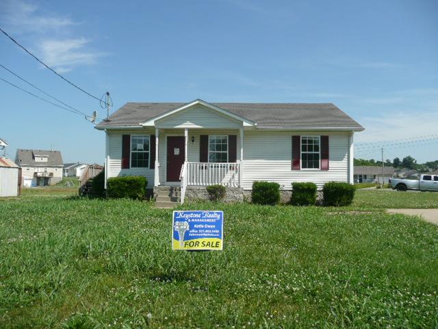 124 Gleaves Lane Oak Grove, KY 42262 - Photo 1 of 14 a front view of a house with a yard