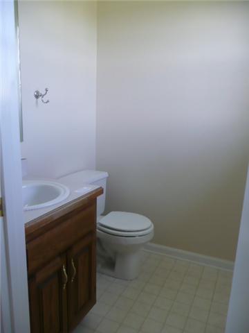 124 Gleaves Lane Oak Grove, KY 42262 - Photo 12 of 14 a bathroom with a sink a toilet and a shower