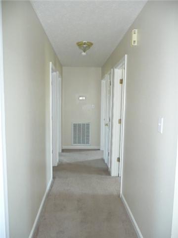 124 Gleaves Lane Oak Grove, KY 42262 - Photo 7 of 14 a view of a hallway with wooden shelves