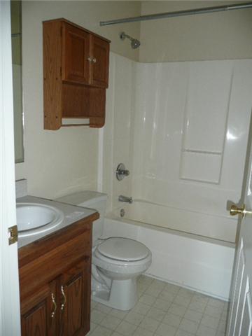 124 Gleaves Lane Oak Grove, KY 42262 - Photo 8 of 14 a bathroom with a granite countertop toilet a sink and bathtub